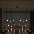 Lustre pluie de seize points LED finition laiton Solenne