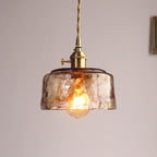 Suspension en verre ambré martelé douille dorée Fauve