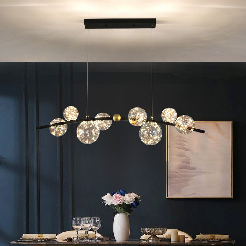 Lustre sphères transparentes étoilées sur barre en métal Zodiaque, finition noire