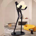 Lampadaire sculpture en résine silhouette humaine globes levés Gerbe