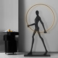 Lampadaire sculpture en résine silhouette humaine à l'anneau Errance