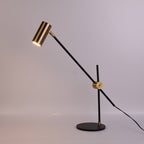 Lampe à poser orientable noire et dorée à balancier Équilibre