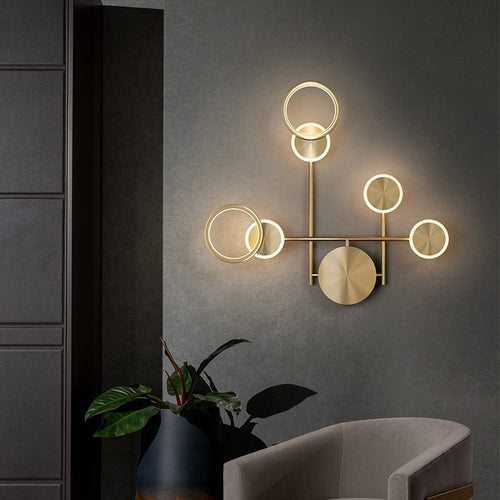 Applique murale dimmable à cercles dorés Médaillon, finition dorée