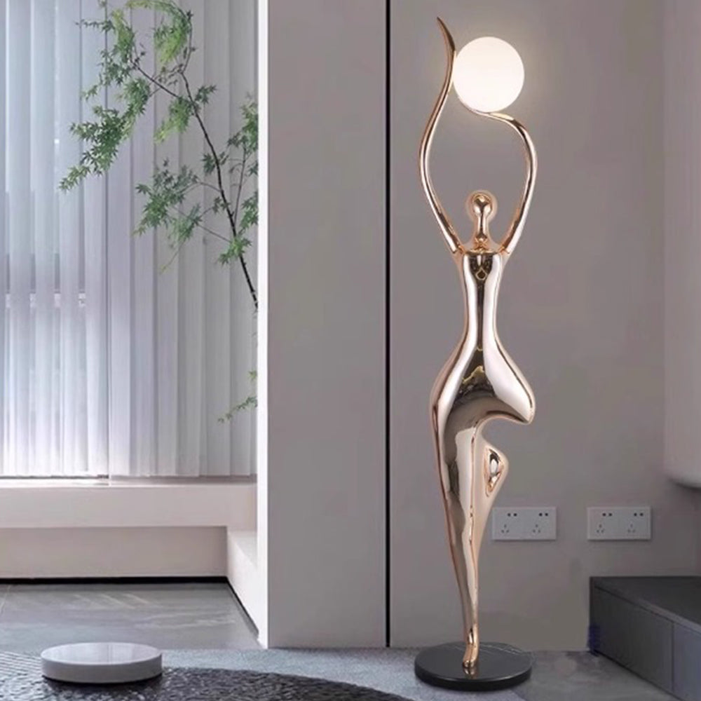 Lampadaire sculpture en résine silhouette humaine dorée Envolée