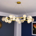 Lustre couronne dorée en fer et verre transparent Nébuleuse