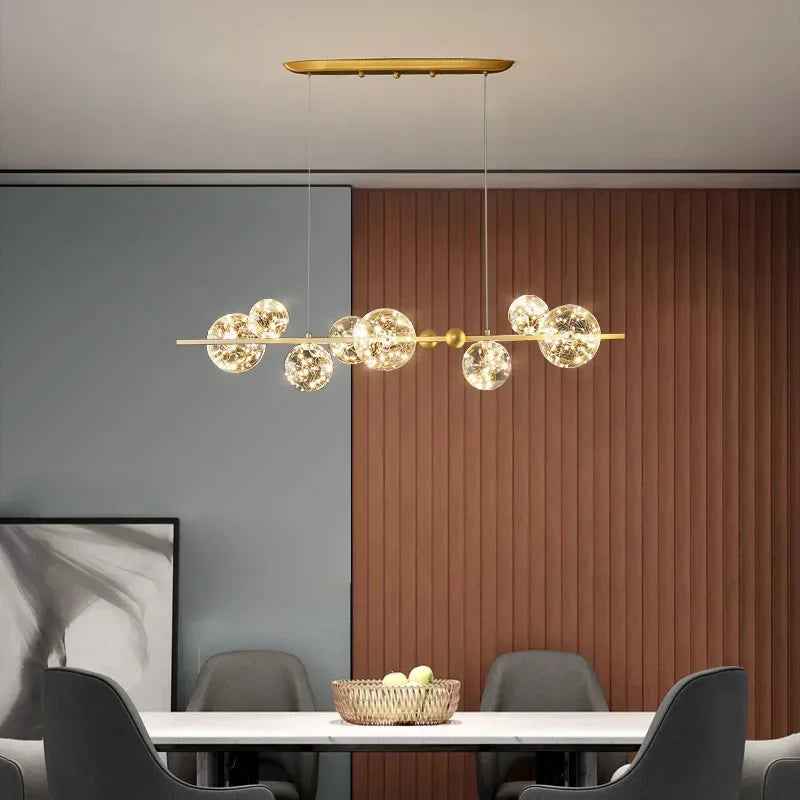 Lustre couronne dorée en fer et verre transparent Nébuleuse