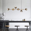 Suspension six globes en verre fumé sur bras dorés Vapeur, finition dorée